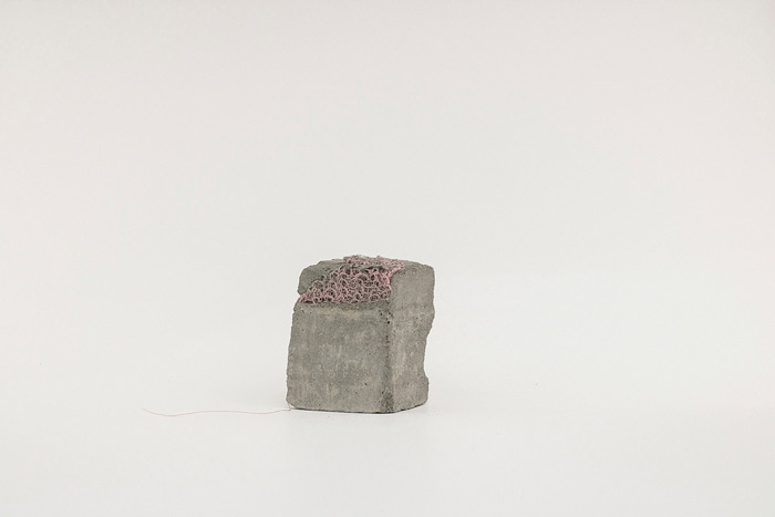 Sara Al Haddad, for self destruction #12, 2014, concrete_4.6x3.7x6.1cm, concrete and free form crocheted embroidery thread. Photo: Marwah Al Haddad