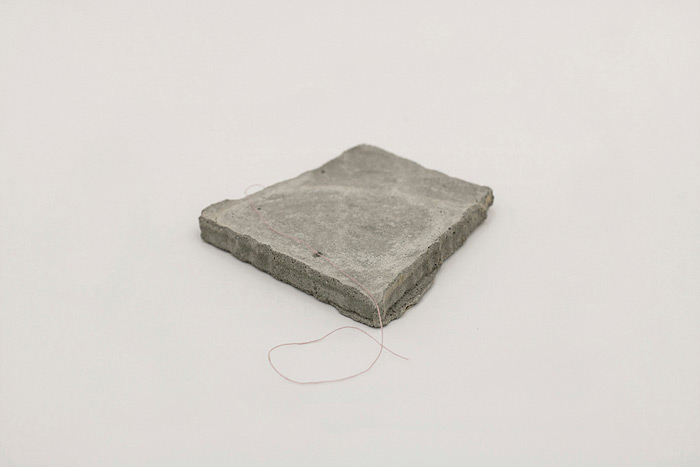 Sara Al Haddad, for self destruction #6, 2014, concrete_10.6x10.x1.4cm, concrete and free form embroidery thread. Photo: Marwah Al Haddad